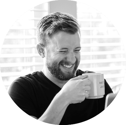 Jon Phillips Matchless Web Studio smiling holding coffee mug